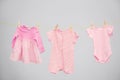 Baby clothes hanging on washing line Royalty Free Stock Photo