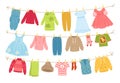 Baby clothes ropes. Washed garment hanging on cords and dries. Boyish and girly things on clothesline with clothespins Royalty Free Stock Photo