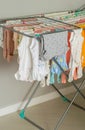 baby clothes to dry after washing, bodysuits, pants, crawlers, t-shirts, wet dries, washing before the birth of the baby Royalty Free Stock Photo