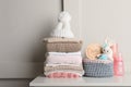 Baby clothes, toy and accessories on white table Royalty Free Stock Photo