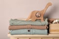 Baby clothes, toys and accessories on wooden rack Royalty Free Stock Photo