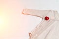 Baby clothes with test-tube and heart. Concept - IVF, in vitro fertilization. Waiting for baby, pregnant. Toned Royalty Free Stock Photo