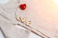 Baby clothes with wooden text IVF and heart. Concept - IVF, in vitro fertilization. Waiting for baby, pregnant, toned Royalty Free Stock Photo