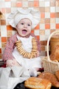 Baby cook with bread