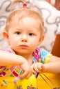 Baby cook girl with utensils on kitchen. Royalty Free Stock Photo