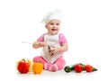Baby in cook hat with healthy food vegetables Royalty Free Stock Photo