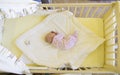 Baby in cot
