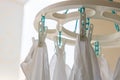 Baby cotton diapers hanging on plastic white cloth clamp for sun