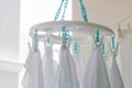 Baby cotton diapers hanging on plastic white cloth clamp for sun