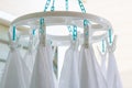 Baby cotton diapers hanging on plastic white cloth clamp for sun