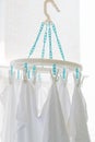 Baby cotton diapers hanging on plastic white cloth clamp for sun