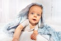 Baby crawl out of towel with happy surprise face Royalty Free Stock Photo