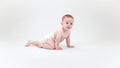 Baby crawling across a white background