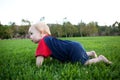 Baby crawling in the grass