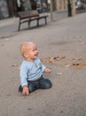 Baby crawling on the street and smiling Royalty Free Stock Photo