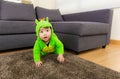 Baby creeping with dinosaur dressing Royalty Free Stock Photo