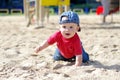 Baby creeps on playground Royalty Free Stock Photo