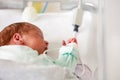 Baby in the crib of a hospital ICU room close-up Royalty Free Stock Photo