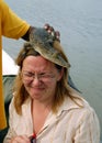 Baby Crocodile on the Woman's Head Royalty Free Stock Photo