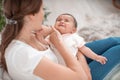 The baby is crying in his mother`s arms. A woman tries to calm her small child Royalty Free Stock Photo