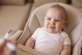 Baby crying and refusing food while mother feeding him Royalty Free Stock Photo