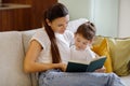 Baby Development. Mother Reading Book With Her Cute Toddler Daughter At Home Royalty Free Stock Photo