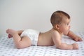 Baby in diapers lying on her belly Royalty Free Stock Photo