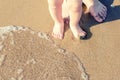 Baby doing his first steps on the beach Royalty Free Stock Photo