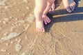 Baby doing his first steps on the beach Royalty Free Stock Photo