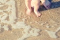 Baby doing his first steps on the beach Royalty Free Stock Photo