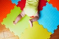 Baby doing tummy time on colorful play mat Royalty Free Stock Photo