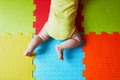 Baby doing tummy time on colorful play mat Royalty Free Stock Photo