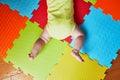 Baby doing tummy time on colorful play mat Royalty Free Stock Photo