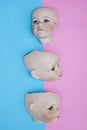 Baby Doll Head, Arms, Face Parts on Blue and Pink Background Royalty Free Stock Photo