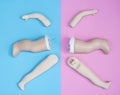 Baby Doll Head, Arms, Face Parts on Blue and Pink Background Royalty Free Stock Photo