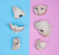 Baby Doll Head, Arms, Face Parts on Blue and Pink Background Royalty Free Stock Photo