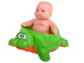 Baby Doll sitting on turtle Royalty Free Stock Photo