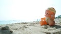 Baby doll on warm beach Royalty Free Stock Photo