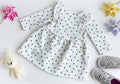 Baby dress for little girl, shoes, knitted toy and accessories Royalty Free Stock Photo