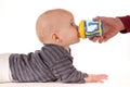 Baby drinking from beaker