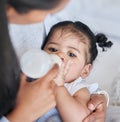 Baby drinking bottle, formula and nutrition with feeding and family, health and growth with early childhood development Royalty Free Stock Photo