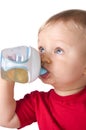 Baby drinking juice from bottle Royalty Free Stock Photo