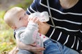 Baby drinking milk from bottle Royalty Free Stock Photo