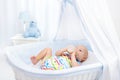 Baby drinking milk. Boy with formula bottle in bed