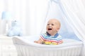 Baby drinking milk. Boy with formula bottle in bed Royalty Free Stock Photo