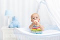 Baby drinking milk. Boy with formula bottle in bed Royalty Free Stock Photo