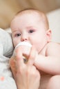 Baby drinking water from bottle Royalty Free Stock Photo