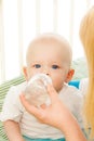 Baby drinking water from bottle