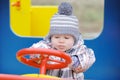 Baby driving car on playground Royalty Free Stock Photo