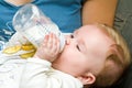 Baby eating from bottle Royalty Free Stock Photo